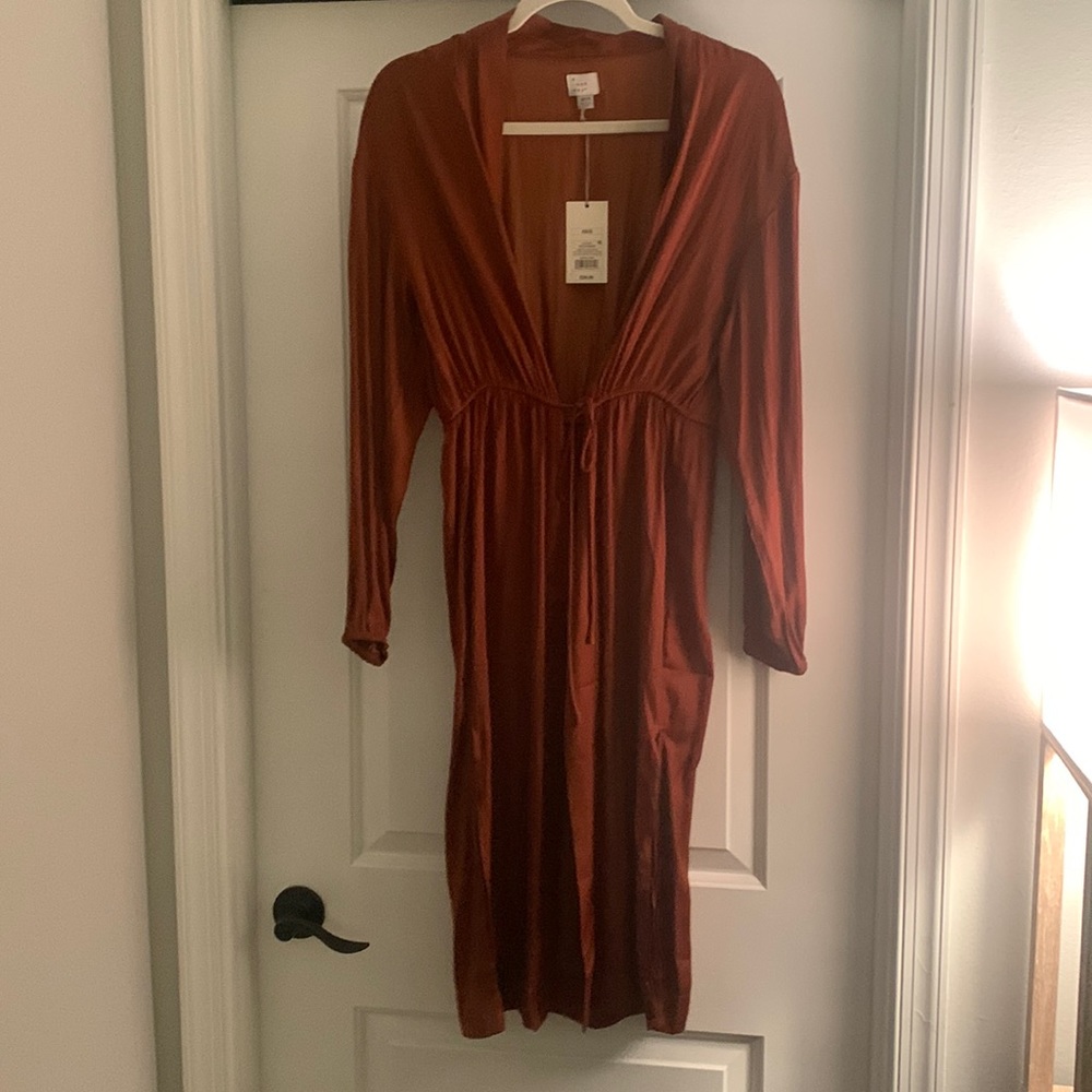 Rust colored long sleeved cardigan type shawl